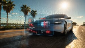 A sleek electric vehicle driving on a sun-baked road with visible heat distortion waves, featuring a digital HUD overlay highlighting a rapidly dropping battery range percentage.